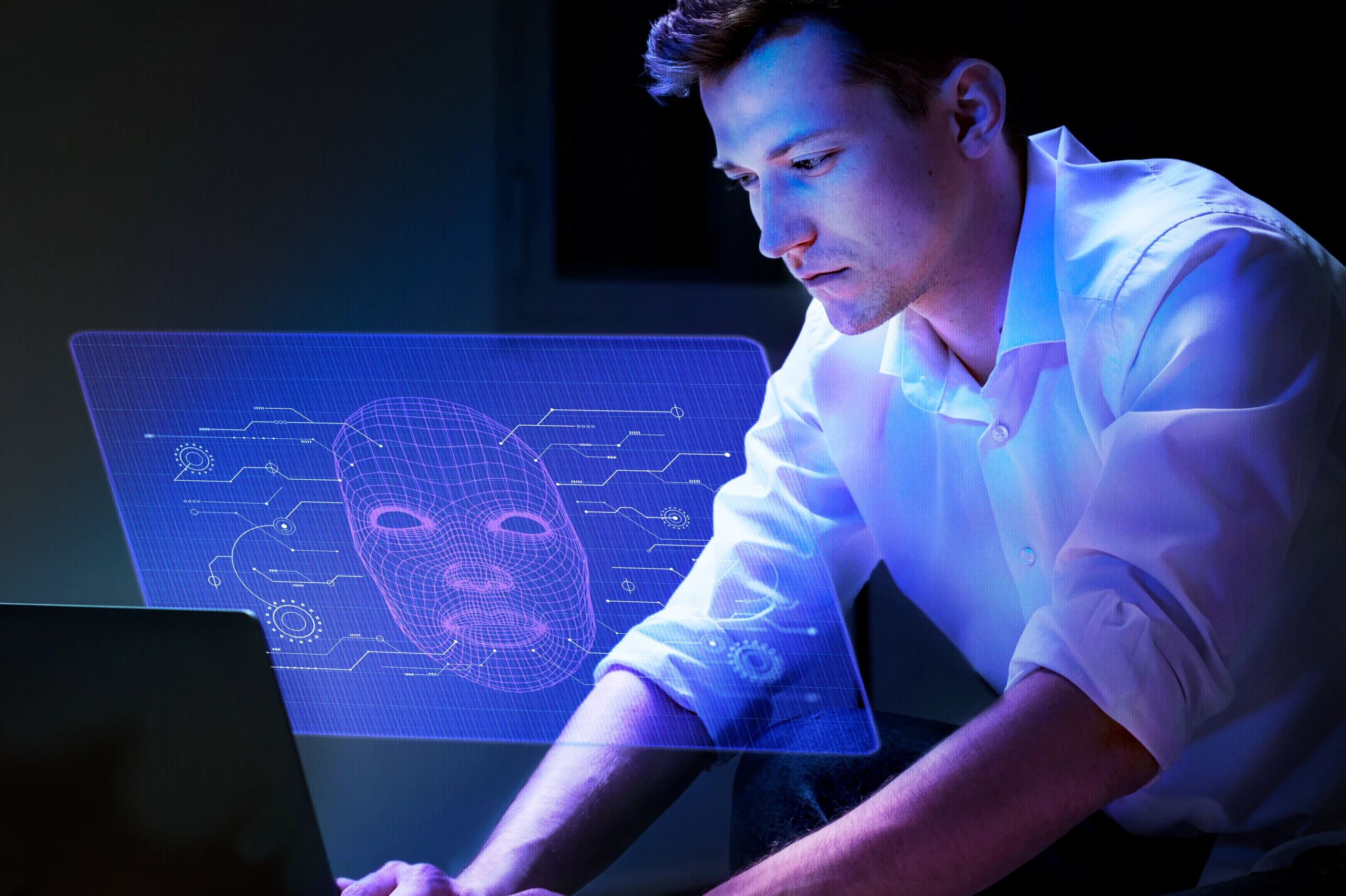 A man interacting with an AI hologram displaying a digital face model, representing how AI agents analyze data and automate tasks.